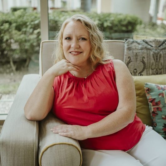 Professional portrait of a female therapist seated outdoors